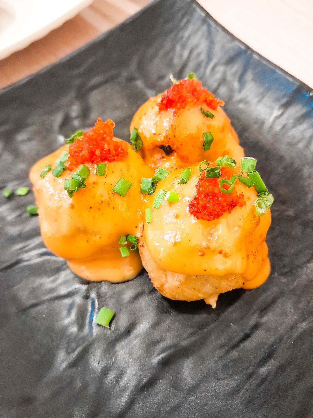 Aburi torched salmon sushi with tobiko Aburi torched salmon sushi with tobiko