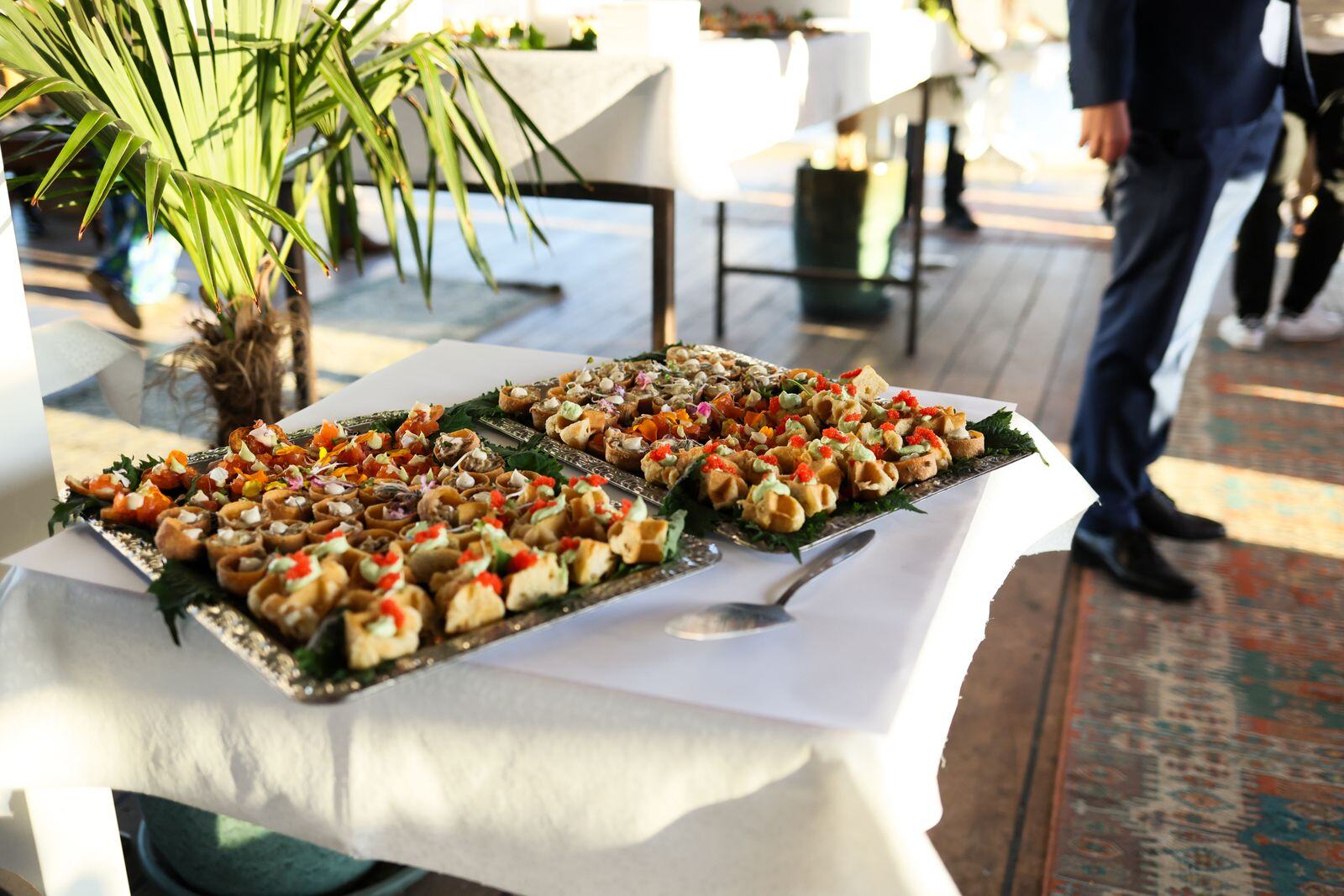 Sushi and canape trays at a cocktail reception in New York