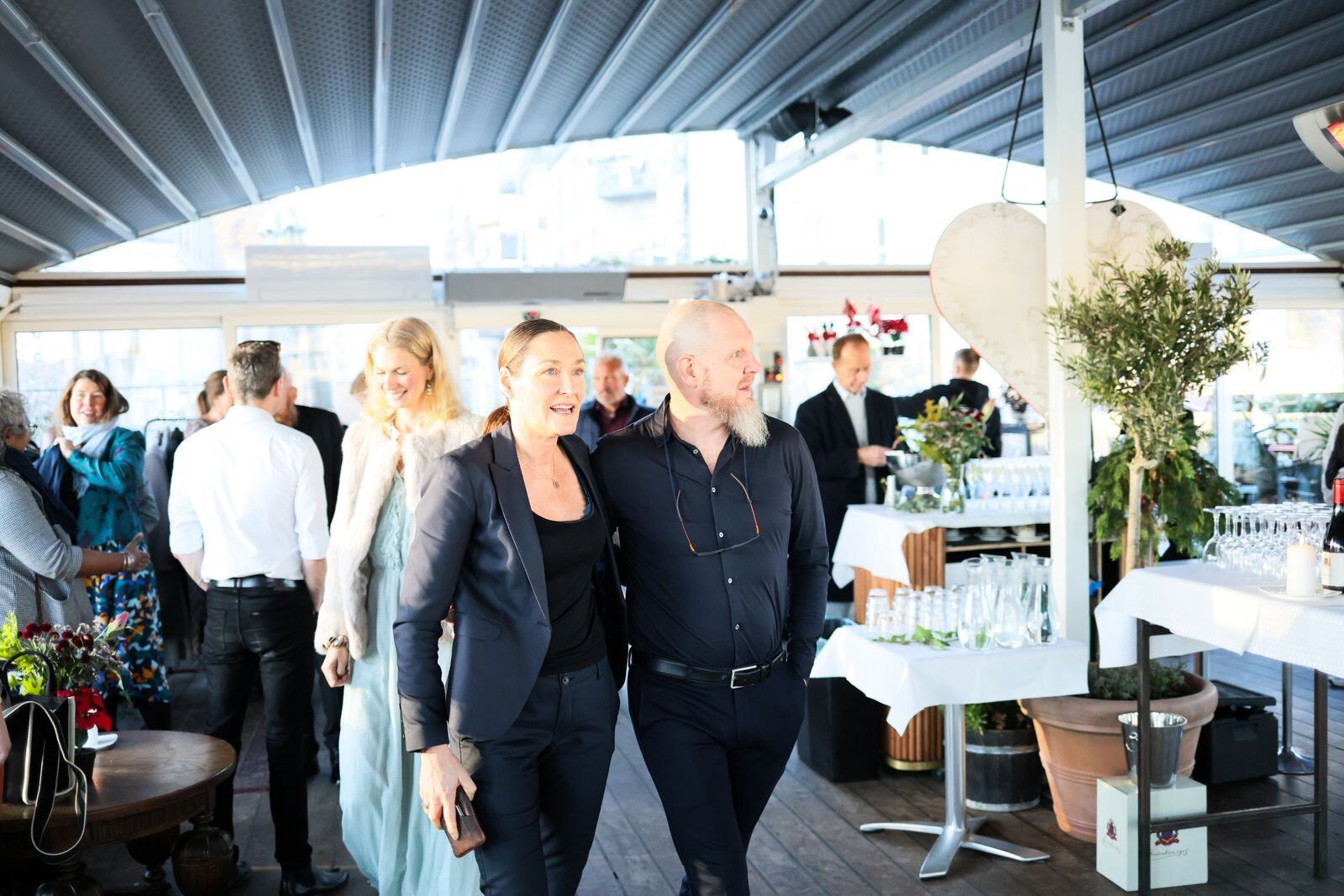Corporate reception guests mingling with live sushi catering in NYC