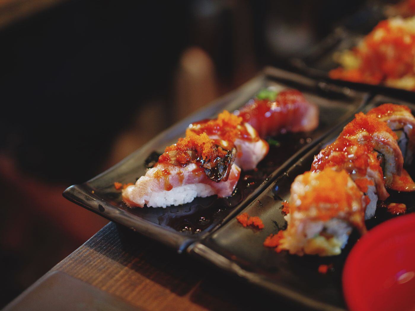 Signature sushi rolls on black slate Signature sushi rolls on black slate
