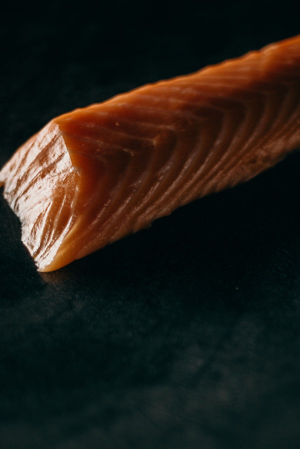 Fresh salmon block before slicing for sushi Fresh salmon block before slicing for sushi