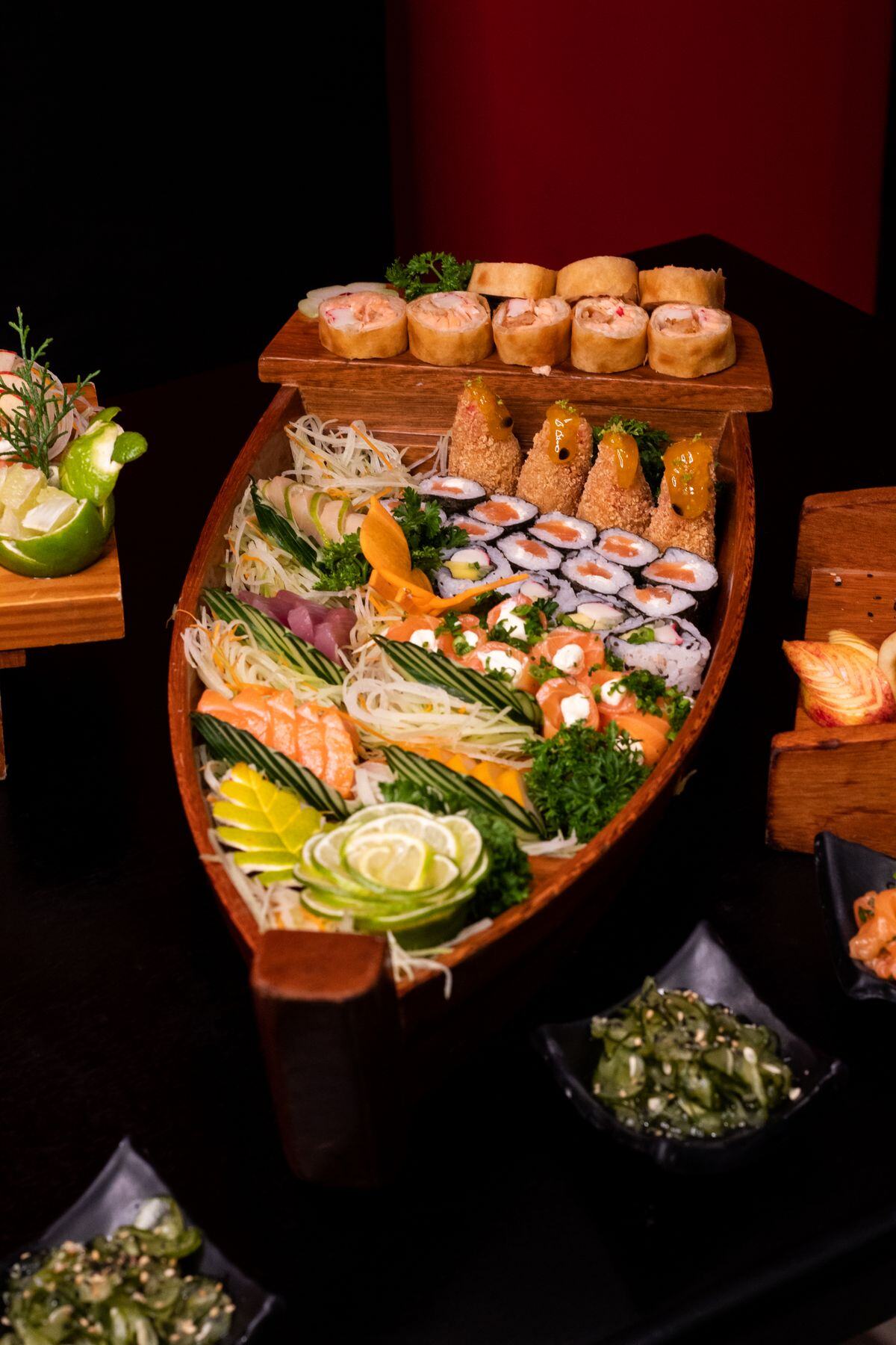 Sushi boat loaded with signature rolls Sushi boat loaded with signature rolls