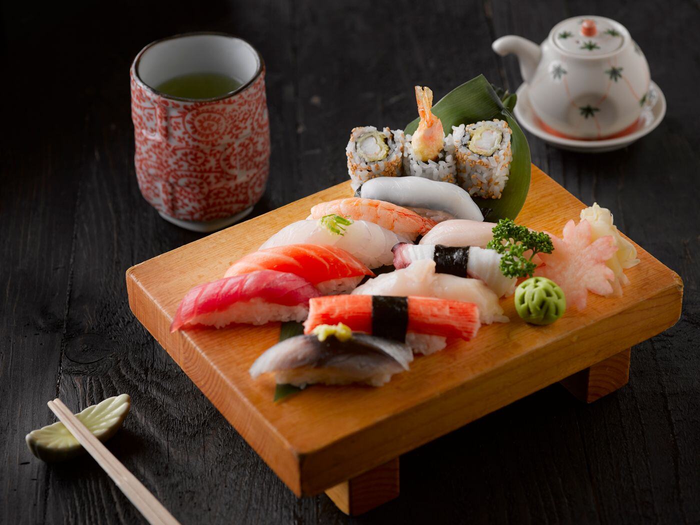 Nigiri set on wooden geta with green tea Nigiri set on wooden geta with green tea
